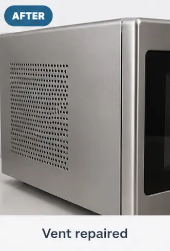 Cleaned and restored side ventilation panel of a microwave after repair.